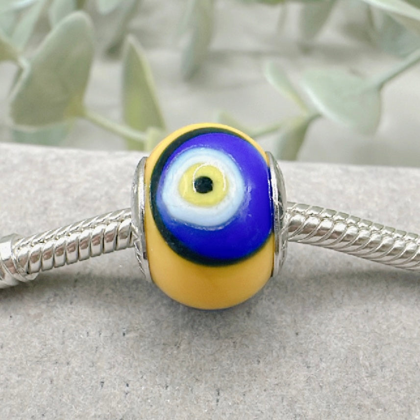 Murano Turkish Evil Eye yellow background